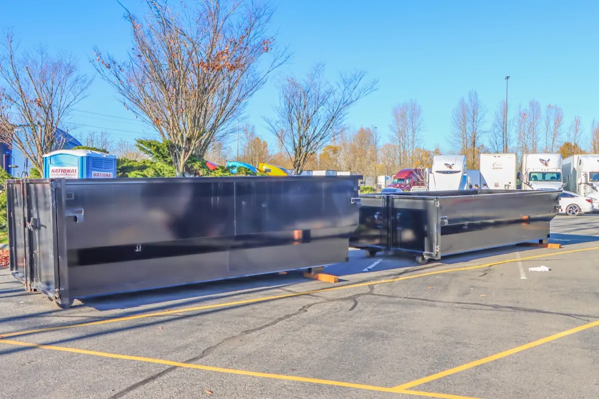 Professional dumpster rental service with roll-off container on residential driveway in Glen Allen